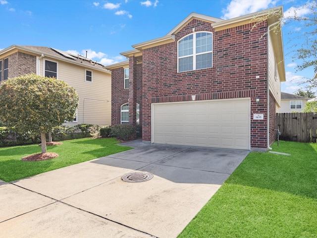 view of front property with a garage and a front yard