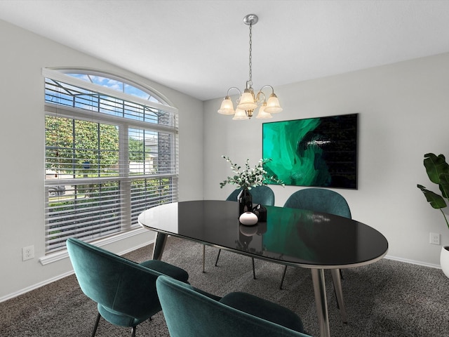 dining space featuring an inviting chandelier and carpet flooring