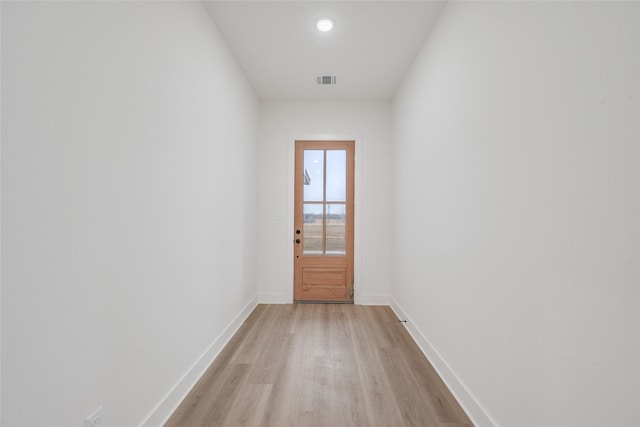 doorway to outside with light wood-type flooring