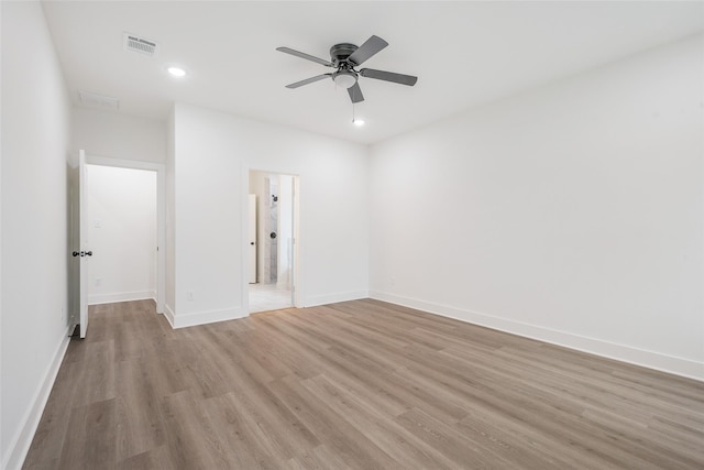 unfurnished room with ceiling fan and light wood-type flooring