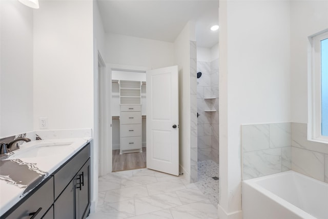 bathroom with vanity and plus walk in shower