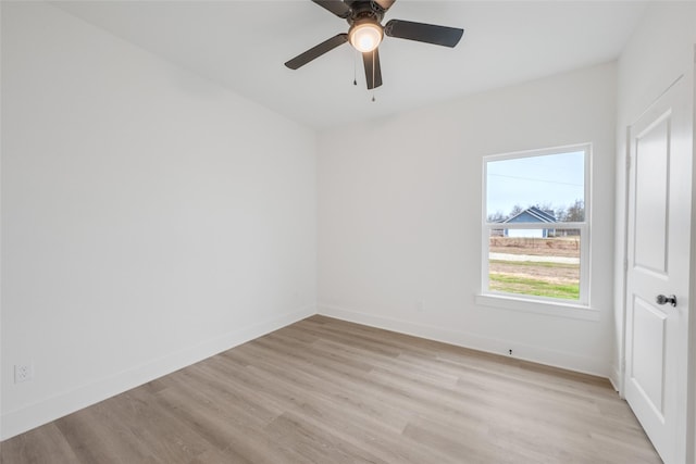 spare room featuring ceiling fan and light hardwood / wood-style flooring