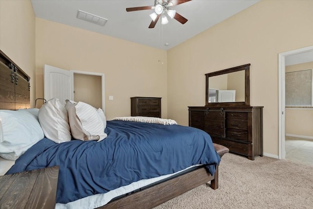 bedroom with light colored carpet and ceiling fan