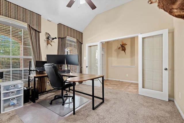 office area featuring lofted ceiling, light tile patterned floors, ceiling fan, and french doors