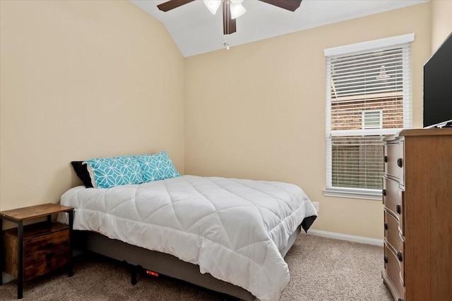 bedroom featuring ceiling fan, light colored carpet, and vaulted ceiling