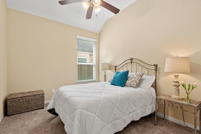 bedroom with ceiling fan, lofted ceiling, and carpet floors