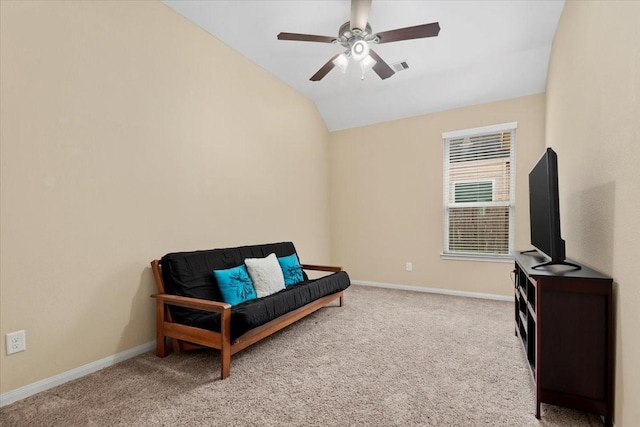 sitting room featuring vaulted ceiling, light colored carpet, and ceiling fan