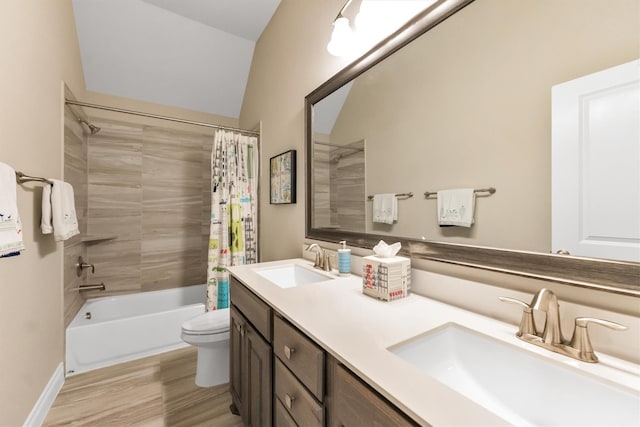 full bathroom featuring vanity, hardwood / wood-style floors, toilet, and shower / bath combo