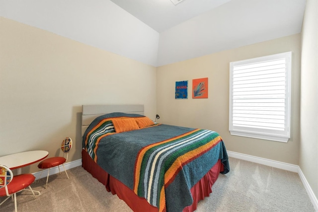 bedroom featuring lofted ceiling and carpet flooring