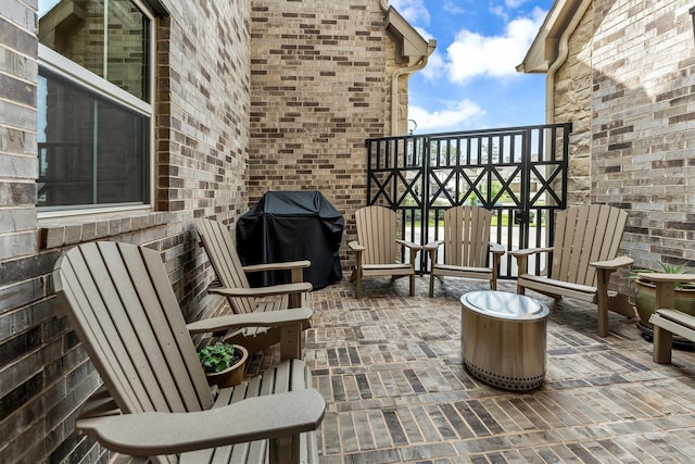 balcony with a grill and a patio