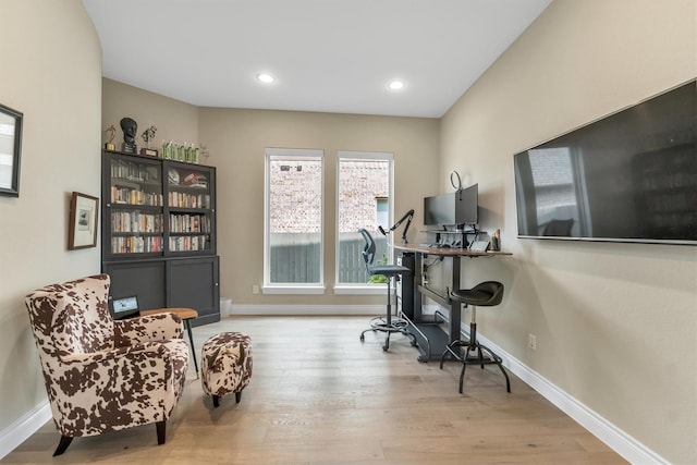 office with light hardwood / wood-style flooring