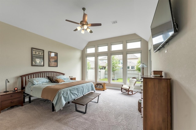 carpeted bedroom featuring lofted ceiling and ceiling fan