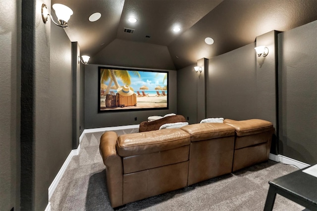 carpeted home theater with lofted ceiling