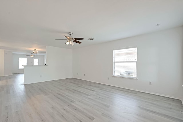 spare room featuring ceiling fan and light wood-type flooring