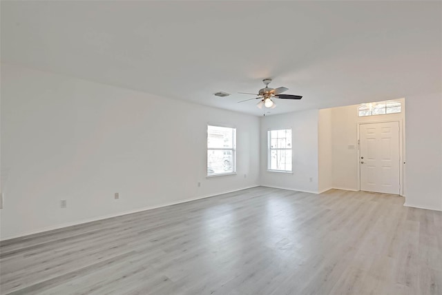 unfurnished room featuring light hardwood / wood-style floors and ceiling fan