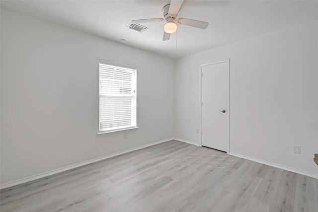 unfurnished room with light hardwood / wood-style flooring and ceiling fan