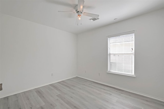 spare room with ceiling fan and light hardwood / wood-style flooring