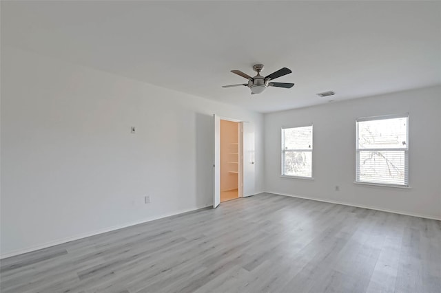 unfurnished room with light hardwood / wood-style floors and ceiling fan