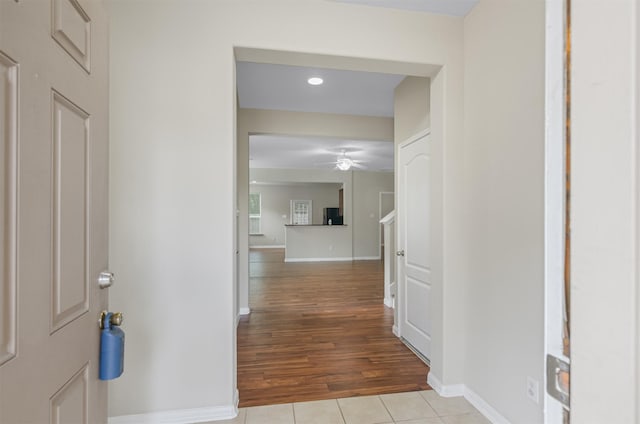 corridor with light tile patterned flooring