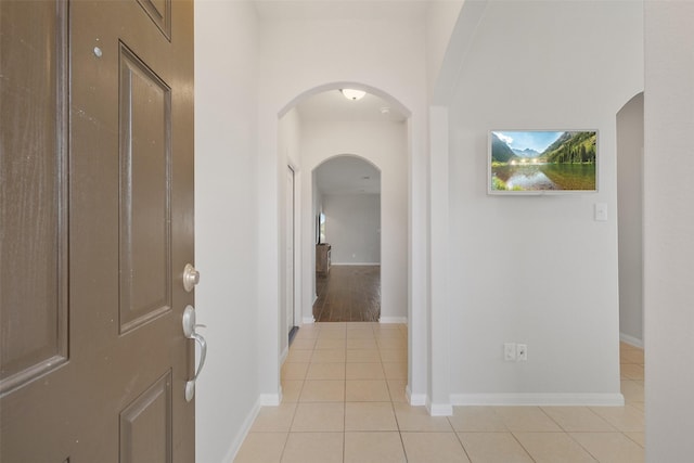 hallway featuring light tile patterned flooring