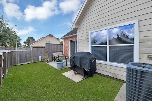 view of yard with a patio area and central air condition unit