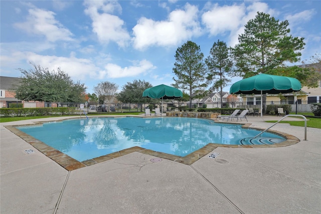 view of swimming pool with a patio area