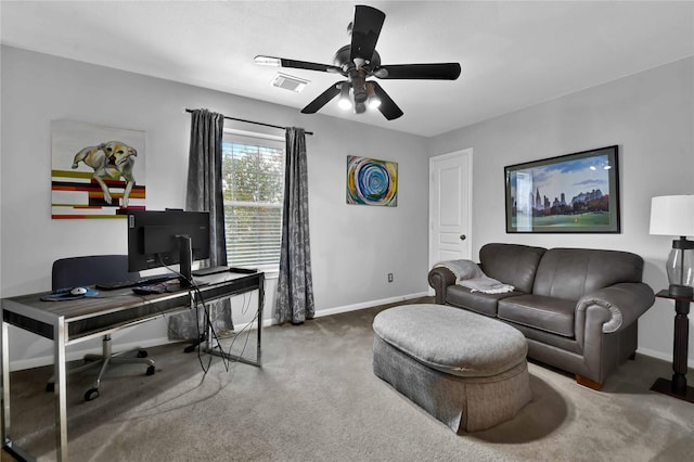 carpeted office space with ceiling fan