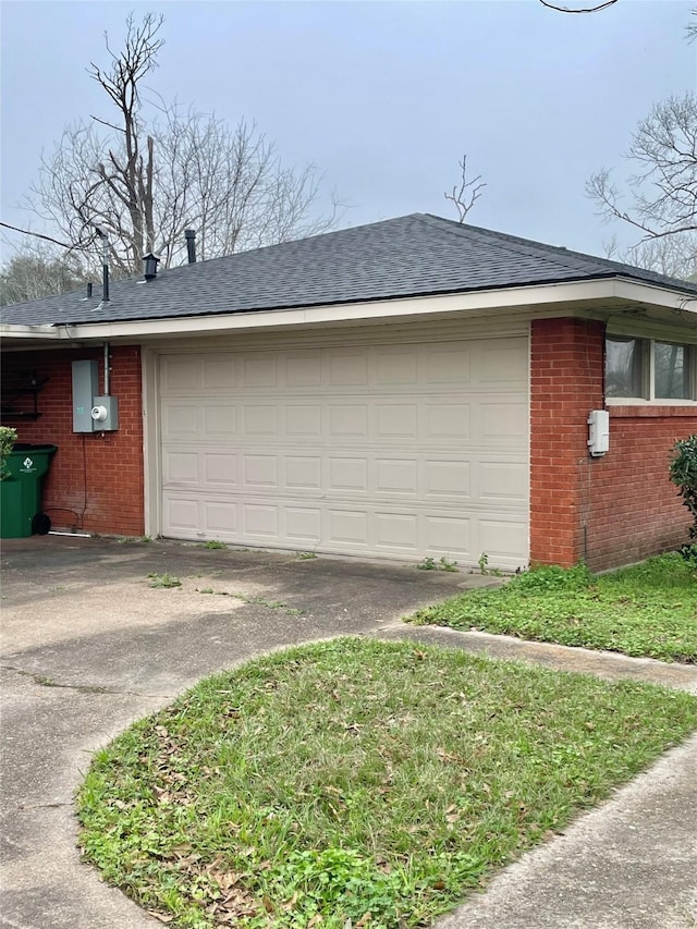 view of side of home featuring a garage