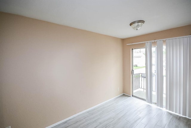 empty room with light wood-type flooring