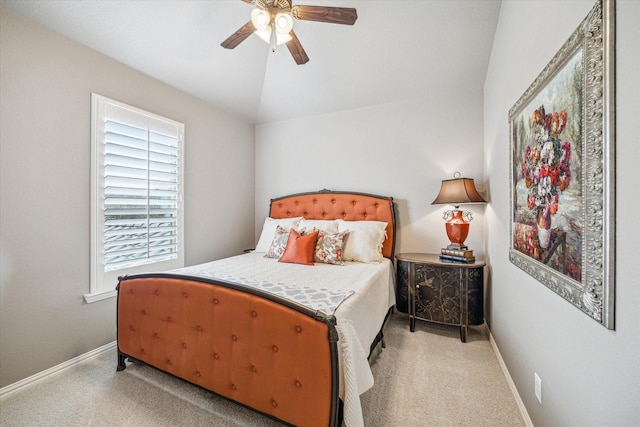 bedroom with lofted ceiling, light carpet, and ceiling fan