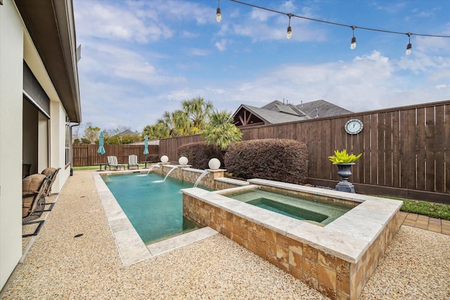 view of pool featuring an in ground hot tub and pool water feature