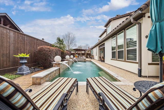 view of swimming pool featuring pool water feature and a patio area