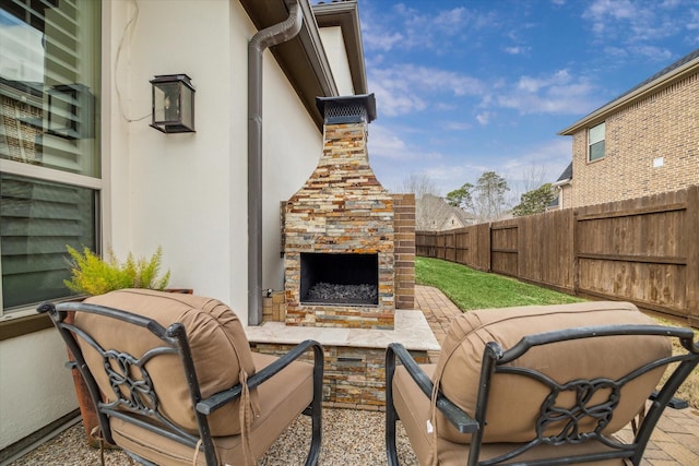 view of patio / terrace with an outdoor fireplace