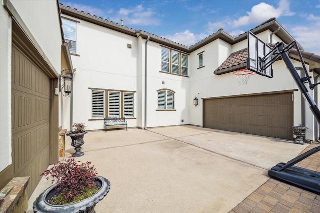 rear view of house with a garage