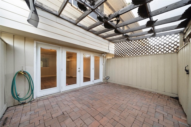 view of patio / terrace with french doors and a pergola