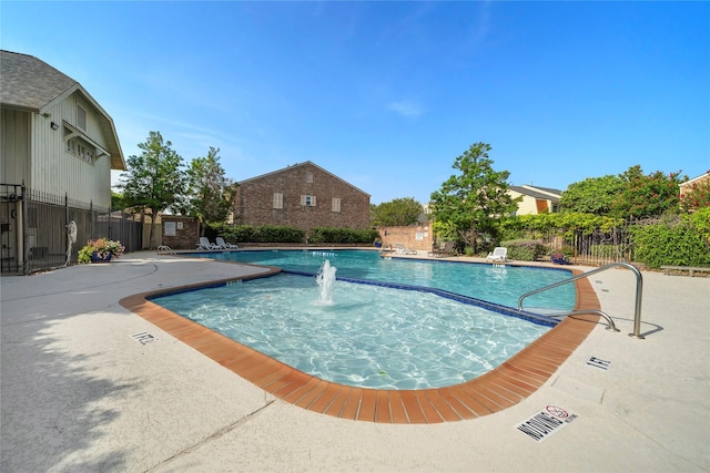 view of pool with pool water feature