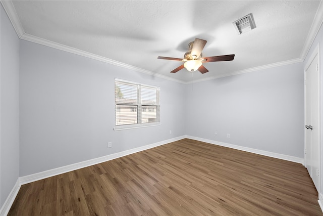 empty room with crown molding, wood-type flooring, and ceiling fan