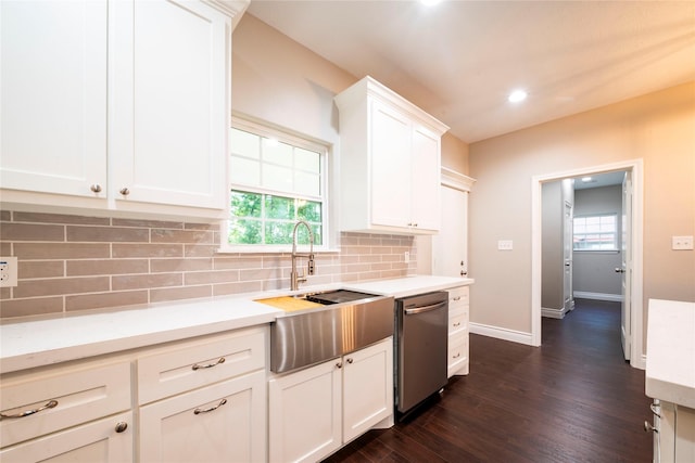 kitchen featuring sink, backsplash, dark hardwood / wood-style floors, white cabinets, and stainless steel dishwasher