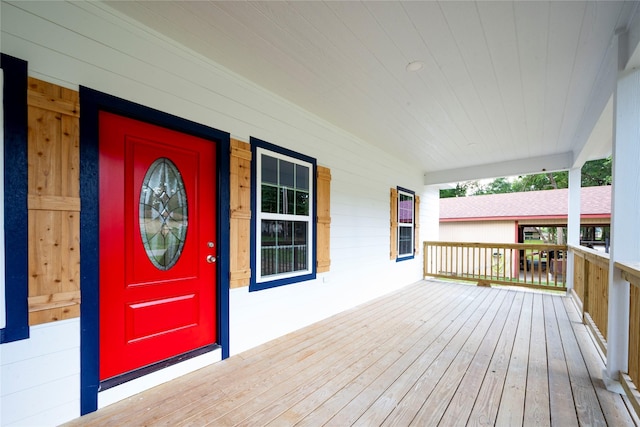 wooden terrace with a porch