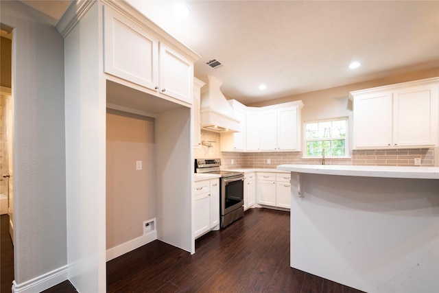 kitchen featuring dark wood-type flooring, white cabinetry, backsplash, custom range hood, and stainless steel electric stove