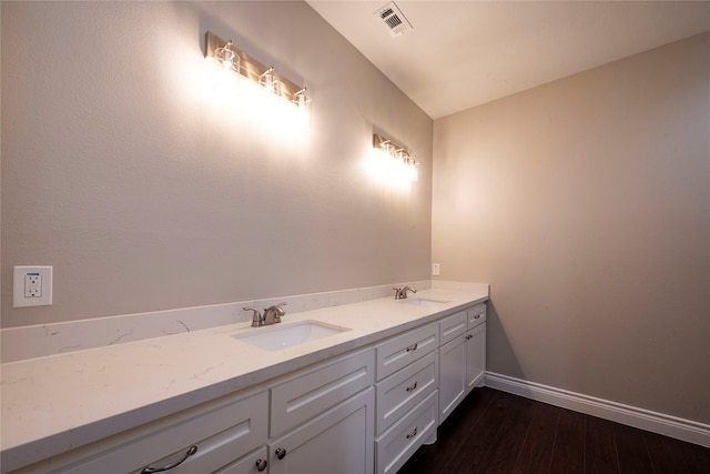 bathroom featuring vanity and hardwood / wood-style floors