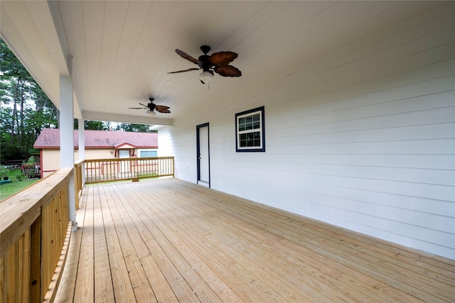 wooden deck featuring ceiling fan