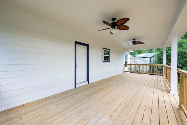 wooden terrace featuring ceiling fan