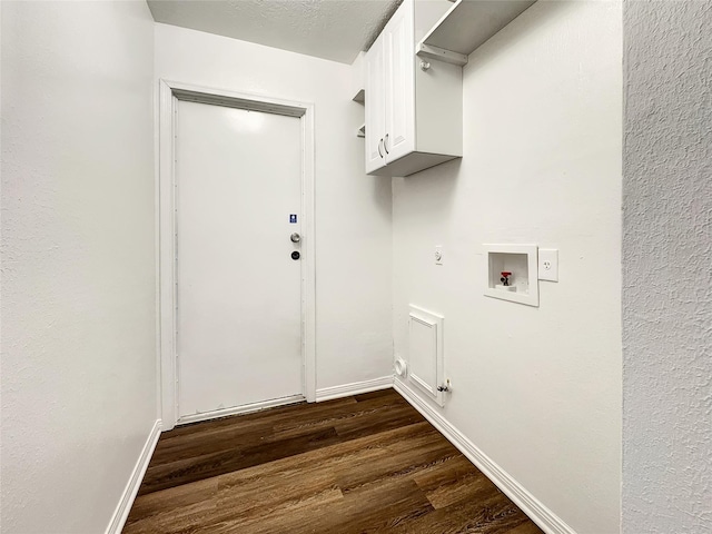 laundry area featuring dark hardwood / wood-style floors, cabinets, hookup for a gas dryer, washer hookup, and electric dryer hookup