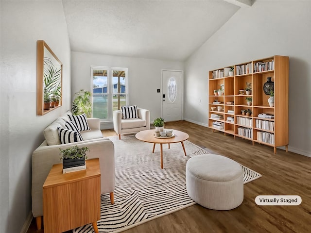 living room featuring dark wood-type flooring and vaulted ceiling