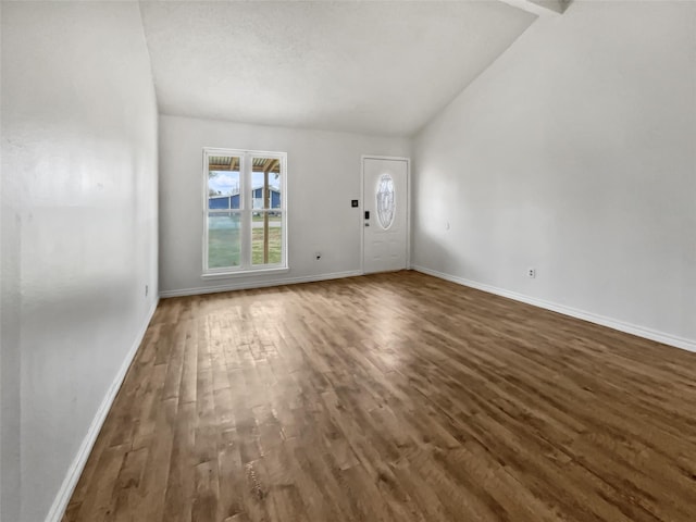 5210 3rd St, Danbury, TX 77534 - entryway featuring vaulted ceiling, wood finished floors, and baseboards