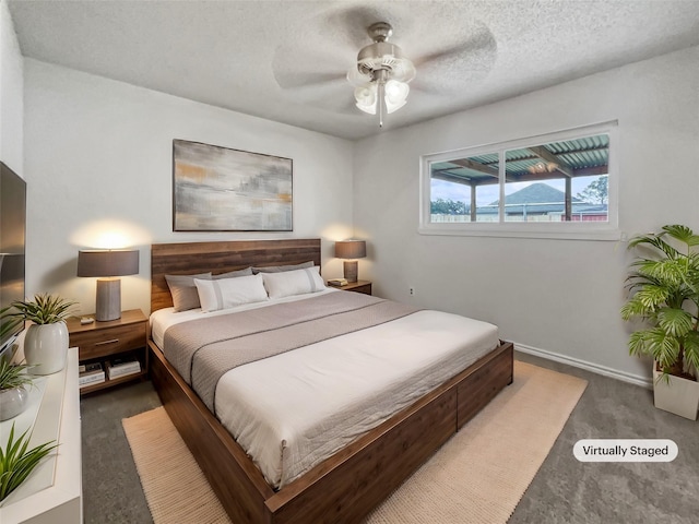 5210 3rd St, Danbury, TX 77534 - bedroom featuring carpet flooring, baseboards, a textured ceiling, and a ceiling fan