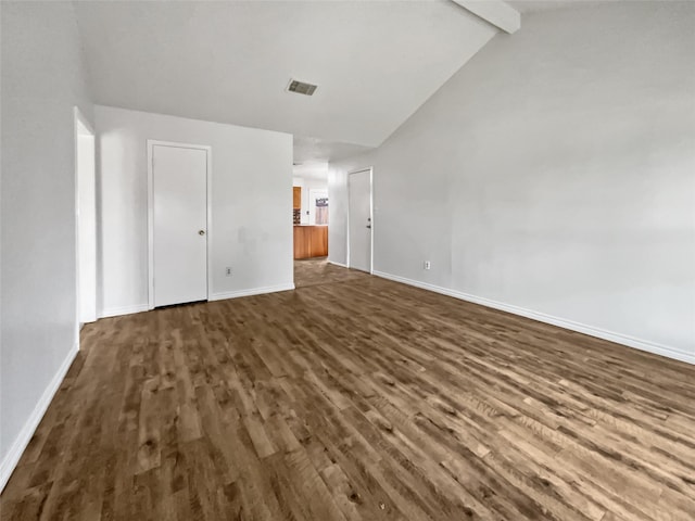 5210 3rd St, Danbury, TX 77534 - unfurnished bedroom with dark wood-type flooring, baseboards, beam ceiling, and high vaulted ceiling