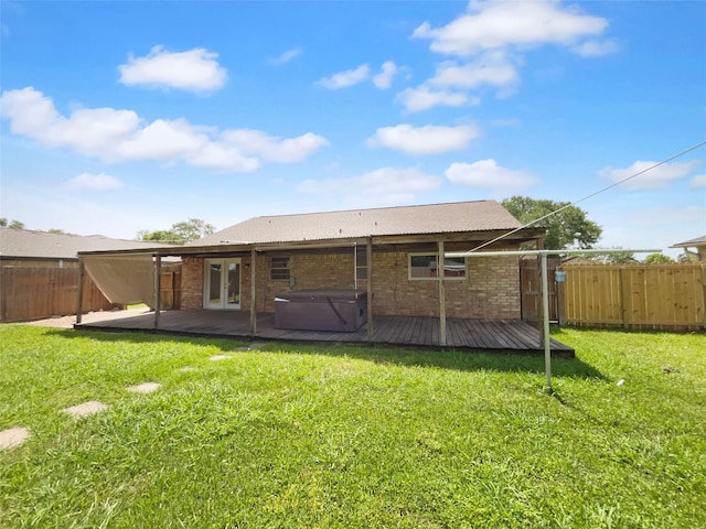 5210 3rd St, Danbury, TX 77534 - rear view of property with a hot tub, french doors, brick siding, a patio, and a deck