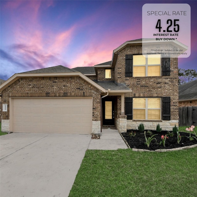 view of front facade with brick siding, an attached garage, and concrete driveway